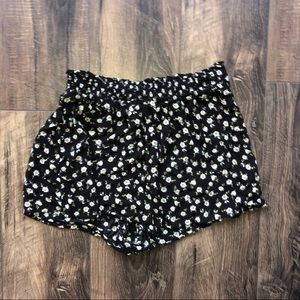 Out from under floral lounge shorts